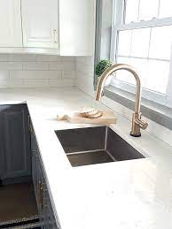 Bronze is a bold metal that will still hold its own when paired with dramatic colors like black, hunter green, charcoal gray, or navy blue. Should Kitchen Faucet Match Cabinets Hardware Mixing Metals