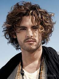 It's got a messy look, but can be set smartly when required. 2009 Men Curls Hairstyle Hairstyle Gallery Long Curly Hair Men Curly Hair Men Long Hair Styles