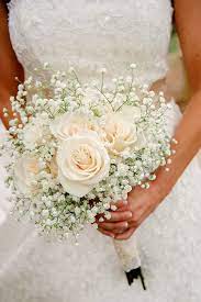Romantic Bridal Bouquet Showcasing Cream Roses White Gypsophila Baby S Breath Babys Breath Bouquet Wedding Flower Bouquet Wedding Wedding Bouquets
