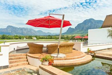 A modern cantilever patio umbrella creating a shaded outdoor retreat, AI generated