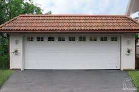 A sectional door is the most common option in the us, which has several horizontal panels hinged together and fitted with rollers. Sectional Garage Doors