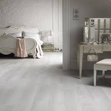 Neutral carpet shades are also a popular choice as they also have a fresh and contemporary look and can make the room feel bigger. Whitewashed Wood Floors White Wood Floors Bedroom Flooring Grey Laminate Flooring