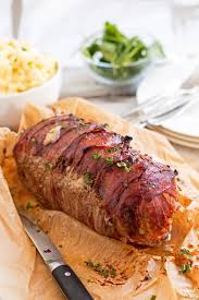 Bacon cheeseburger meatloaf topped and stuffed with cheddar cheese and bacon is the ultimate meatloaf. Iqkwialouuumjm