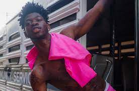 Lil nas x strokes a fake baby bump while announcing he's 'pregnant' with debut album in jaw dropping video. T6mgt0uephuxzm