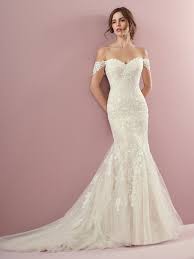 Amber Ivory Fit And Flare Wedding Dress By Rebecca Ingram Classic Lace Motifs Cascade Over This Tul Fitted Wedding Dress Wedding Dresses Mermaid Wedding Dress