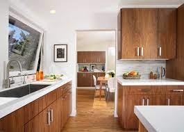 Matte black chandeliers above butcher block countertop makes the delightful environment of a beach style kitchen. White Countertop Wood Cabinets Houzz