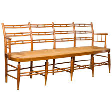 A fanciful french faux bois concrete garden set with table, bench and seat; Rustic 19th Century French Walnut Bench With Open Back And Long Rush Seat English Accent Antiques