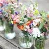 Colorful wildflower wedding bouquets with a burlap wrap. 1
