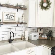Subway Tile Kitchen Backsplash In White Inside A Kitchen With White Cabinets Woode In 2020 Farmhouse Kitchen Backsplash Farmhouse Sink Kitchen Farmhouse Kitchen Design