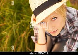 Looking casual in a straw fedora, white top and jeans, "GCB" star Leslie  Bibb leaves the Byron Tracy Salon in Beverly Hills, CA. 8th May 2012 Stock  Photo