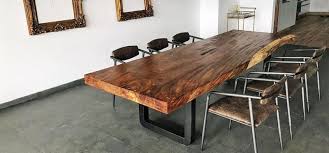 It's crafted from solid wood, with either an oak or walnut wood grain tone, and has a rounded surface set on four oval legs. Striking Parota Wood Tables For Modern Designs Parotas Mexico