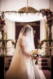 Bride With Veil Over Face And Bouquet Wedding Hairstyles With Veil Veil Over Face Wedding