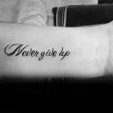 The phrase means 'never give up' and is made up of 4 letter words. 60 Never Give Up Tattoos For Men Phrase Design Ideas