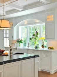 I like the raised window and the glass cabinets around it. My Kitchen Remodel Windows Flush With Counter The Inspired Room