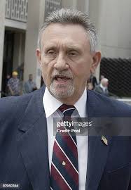 Modesto detectives Jon Buehler and Jon Evers leave the San Mateo... News  Photo