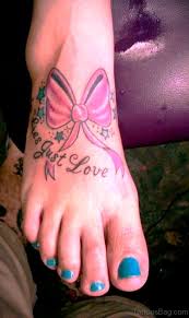 Underneath the ribbons, it says, 'courage, hope, strength.' 42 Attractive Cancer Ribbon Tattoos On Foot