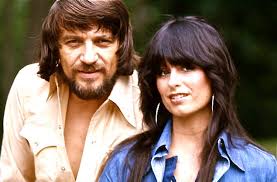 You followed me down so many roads baby.. I've picked wild flowers and sung  you soft sad songs.. And every road we took God knows, Our search was for  the truth.. And