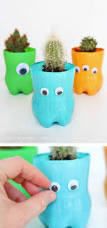 How To Make Plastic Bottle Planters Recipe Plastic Bottle Planter Bottle Crafts Diy Plastic Bottle