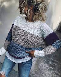 Woman With Blonde Balayage Hair In A Ponytail Wearing A Striped Sweater And Jeans Short To Mid Length Hairstyles Fashion Boho Fashion Winter Casual Outfits