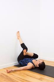 You Ll Feel So Much Better After This Restorative Wall Yoga Sequence Wall Yoga Flexibility Workout Yoga For Beginners