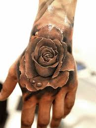 60 Eye Catching Tattoos On Hand Cuded Rose Hand Tattoo Rose Tattoos For Men Hand Tattoos For Guys