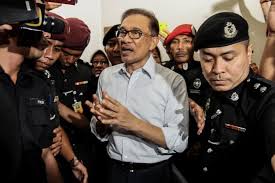 Anwar ibrahim and his wife wan azizah, pkr president and malaysia's deputy prime minister, wave to his supporters outside the party's headquarters. Anwar To Be Pardoned In Post Election Malaysia Arab News