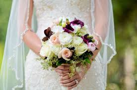 Spring wedding bouquet with coral charm peony, white daisy, yellow turtle rose, white spray rose. Ranunculus Calla Lily Rose Bouquet