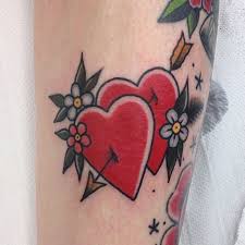 Maybe you would like to learn more about one of these? Two Hearts Stabbed With Arrow Tattoo Tattoogrid Net