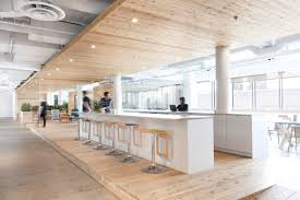 This Remodelled Office Interior By Atelier Pierre Thibault Is Divided By A Long Wood Clad Walkway Dotted With Office Interiors Interior Office Interior Design