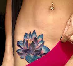 If there are more details to the design, the old tattoo will be less. Lotus Tattoo Coverup On Hip Colorful Meaningful Painful Flower Cover Up Tattoos Flower Thigh Tattoos Blue Lotus Tattoo