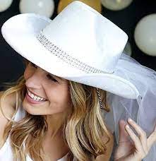 The Bride Will Turn Heads In This White Western Party Hat The Hat Features A Bling Band And Veil Ma Cowgirl Boots Wedding Cowgirl Bachelorette Cowgirl Wedding