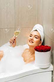 Dress the bathtub opening like a. Happy Beautiful Woman Relaxing In A Bubble Bath Tub Holding Stock Photo Picture And Royalty Free Image Image 134661513