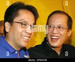 Philippine Liberal Party President Sen. Manuel "Mar" Roxas III, left, and  partymate Sen. Benigno "Noynoy" Aquino III smile during their press  conference at the historic Club Filipino, in suburban San Juan, east of  Manila, Philippines