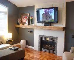 Check out 13 diy fireplace surrounds made with reclaimed wood. Fireplace Mantel Colors Wood Beam Mantel That Extends To Floating Shelf With Cabinets Below And Fireplace Bookshelves Fireplace Remodel Fireplace Design