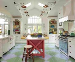 French country kitchen with white and gold french range hood in an arched cooking alcove. 11 Modern French Country Kitchen Ideas