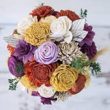 I Saw This On Shark Tank She Recycles And Creates Flowers That Will Be Good Forever One Idea Eco Flowers Wood Flowers Diy Wedding Flowers