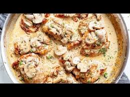 Crispy Chicken Thighs In A Thick And Creamy Mushroom Garlic Sauce With A Sprinkle Of Her Chicken Thights Recipes Creamy Chicken Recipes Creamy Mushroom Chicken