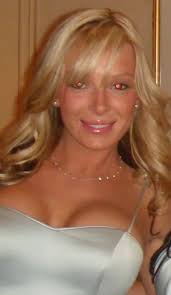 This is my mom (dies in 94) and my older brother (paralyzed in 89). I'd be  appreciative if someone could clean this picture up. I'd like to frame it  and send it