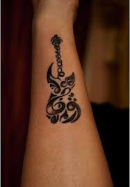 This tattoo of musical notes has splash of watercolors on the background. 115 Music Notes Tattoos For The Music Lovers