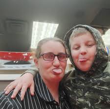 This 11x14 photograph of Cotton Nash and Coach Adolph Rupp pictures the two  of them with Rupp's four championship trophies. When this photo was taken,  Cotton was the leading scorer in UK