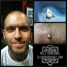 classy body art an albany body piercing studio news third eye piercing dermal piercing skin piercing