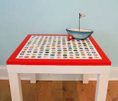 One of the coolest parts of this project was blasting the table with a small hand torch to get rid of the bubbles. Diy Cheap And Chic Bottlecap Table My So Called Crafty Life