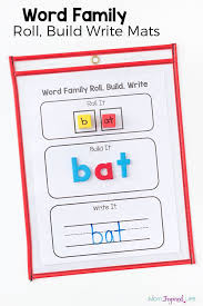 These words highlight the short vowels such as the a in cat , the e in bed , the i in fin , the o in top. Teaching Word Families With Roll Build And Write Mats