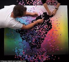 Each tile is an individual color and the task is to place each color exactly in relation to every other color in this spectrum puzzle. Time Lapse Video Shows 5 000 Piece Jigsaw Being Completed Daily Mail Online