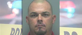 Florida man charged with slugging softball umpire