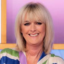 Loose Women's Jane Moore stuns in daring swimsuit during luxury getaway
