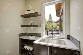 Though this designer opted for white cabinets on most of the kitchen, adding a deep gray pantry is a great way to add dimension to the space. Bathroom With Dark Vanity Cabinet With Quartz Counter Top And Subway Tile Backsplash Northwest Usa Stock Photo Picture And Royalty Free Image Image 89827452