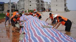 /vcg rescuers transfer residents trapped by floodwater in ji'an city, east china's jiangxi province, july 10, 2020. Watch Flooded Southern China Braces For More Storms Loop Barbados