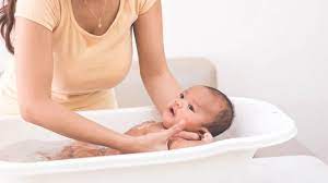 Support his head in your hand and. How To Keep Water Out Of Baby S Ears During Bath Common Errors
