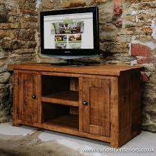 The most common wooden tv stand material is wood. Plank Tv Unit Rustic Wood Tv Media Units Curiosity Interiors